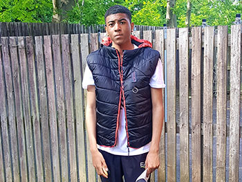 Shelana's son, Rimarni, wearing the 'Pierce Resistant' gilet.