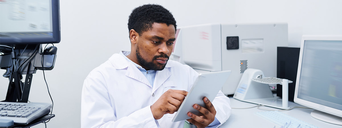 An academic clinician looking over a report