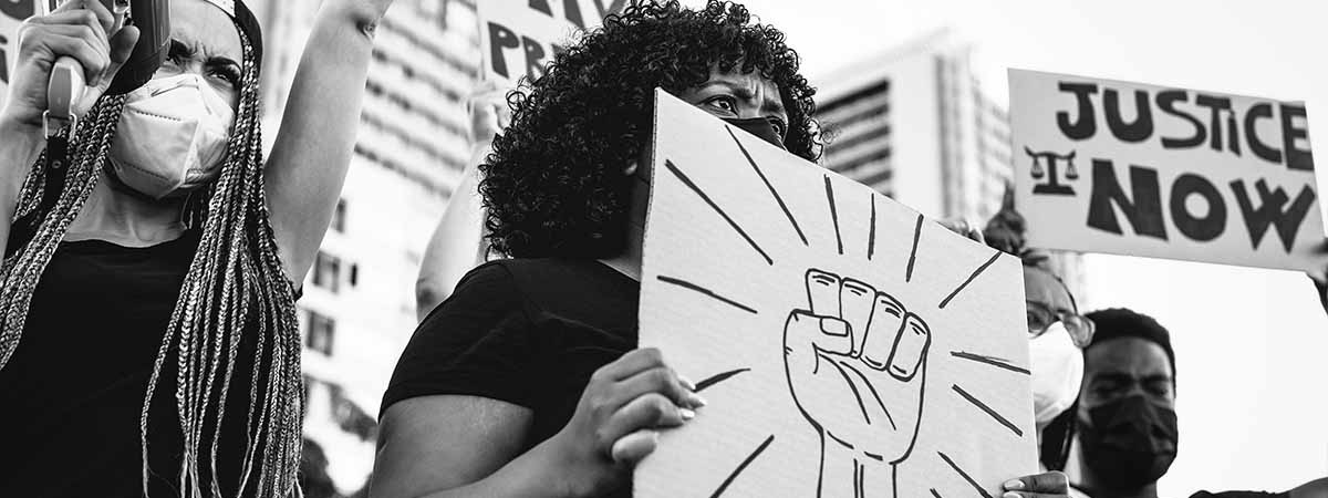 BLM 1200x450 - Black and white image of Black Lives Matter protesters