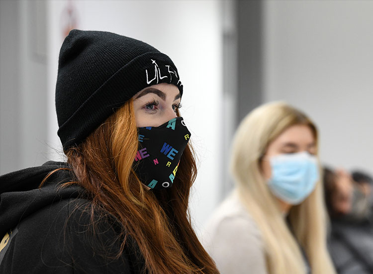 Female student in class with a face mask on