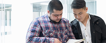Innovation Management Image 341x139 - Two men looking at an iPad