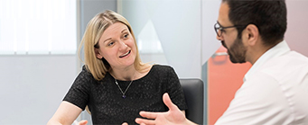 Insurance and Risk Management Image 341x139 - Man and woman at a table