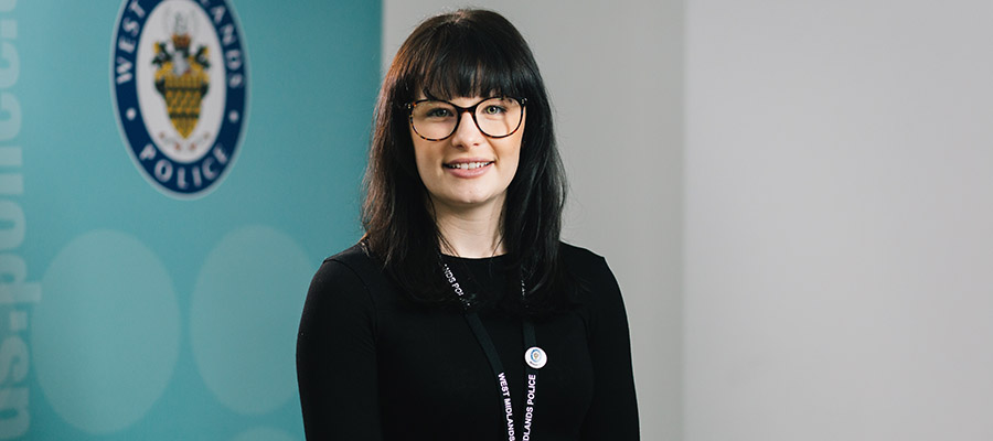 Jemma Stanford 900x400 - Jemma stood infront of the West Midlands Police logo