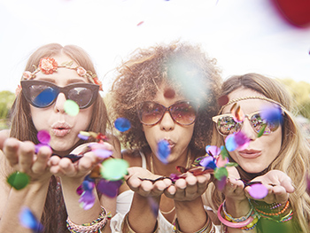 BLSS July Whats On Guide Image 350x263 - Three women blowing confetti at the camera