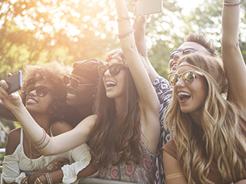BLSS June Whats On Guide Image 350x263 - Men and women in the sunshine at a gig