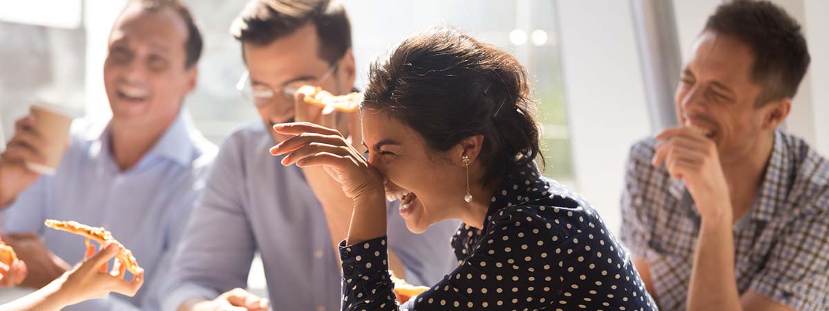 Organisational Behaviour 1200x450 - People laughing