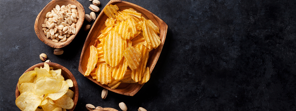 Image of crisps and nuts on a table