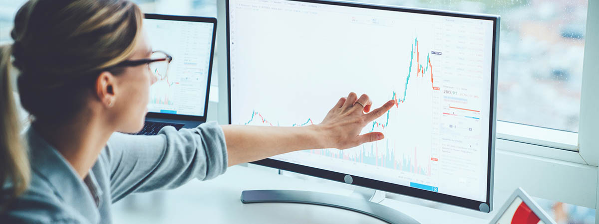 What jobs can I get with a acc-fin-eco degree 1200x450 - Woman looking at stats